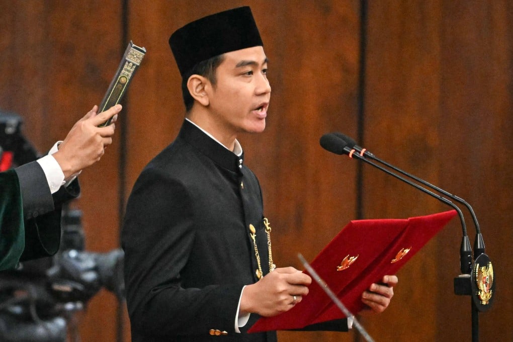 Indonesian Vice-President Gibran Rakabuming Raka takes the oath of office at the Parliament building in Jakarta in October 2024. Gibran faces ongoing debate over his educational qualifications. Photo: AFP
