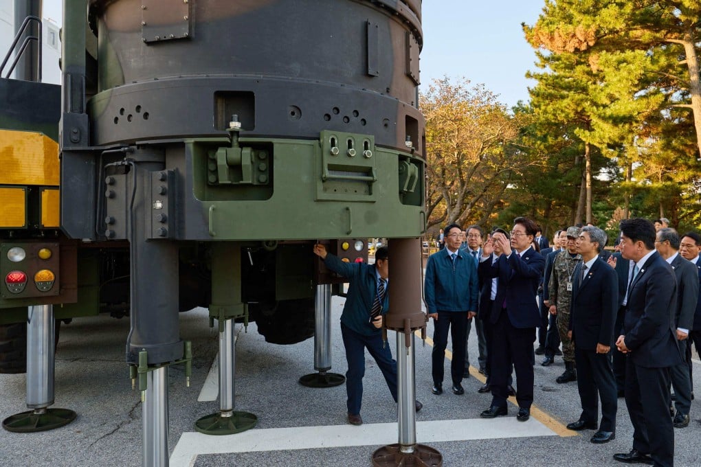 South Korean President Lee Jae Myung (third from right) looks at the Hyunmoo-5 missile at an undisclosed test site in the country on Thursday. Photo: The Blue House / AFP