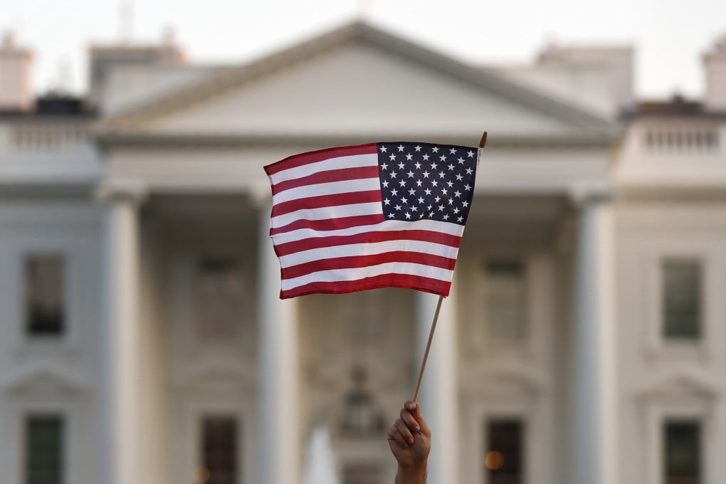 An Ameerican flag is waved outside the White House. The proposal comes amid the Trump administration’s broader immigration crackdown. Photo: AP