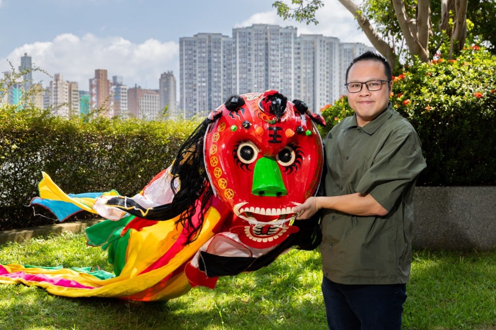 Joseph Lau holds a pixiu puppet, used in a Hakka art form he is documenting. Photo: Kong Yat-pang