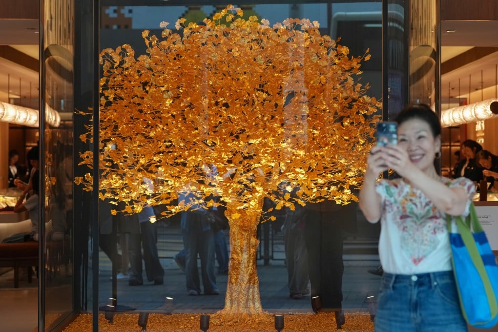 A Golden Ginkgo Tree crafted from nearly 40,000 grams of pure gold and standing 2.1 metres tall is displayed at Chow Tai Fook’s flagship store on Canton Road, Hong Kong, on April 26. Photo: Karma Lo