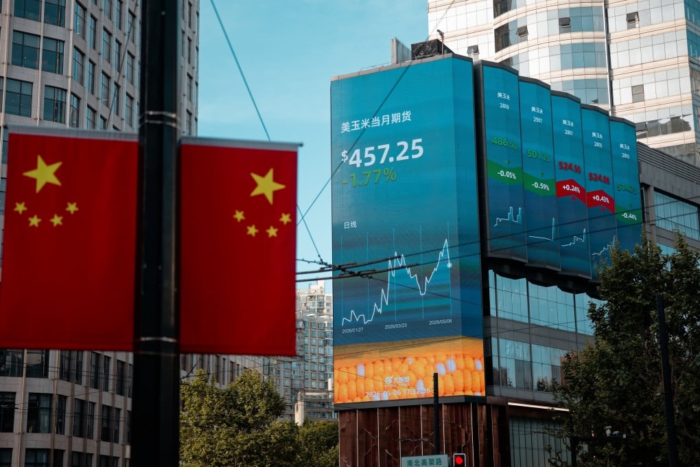 A large screen displays stock exchange and economic data in Shanghai. Photo: EPA