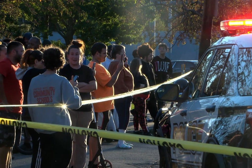 Bystanders gather outside the scene of a shooting in Erie, Pennsylvania, on Friday evening. Photo: WJET via AP
