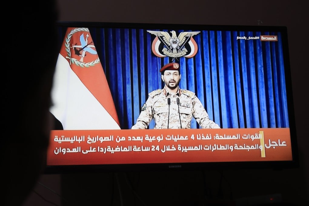 Houthi military spokesman Yahya Sarea delivers a televised statement in Sana’a, Yemen on Sunday. Riyadh’s international airport was hit by fresh strikes on Sunday. Photo: EPA