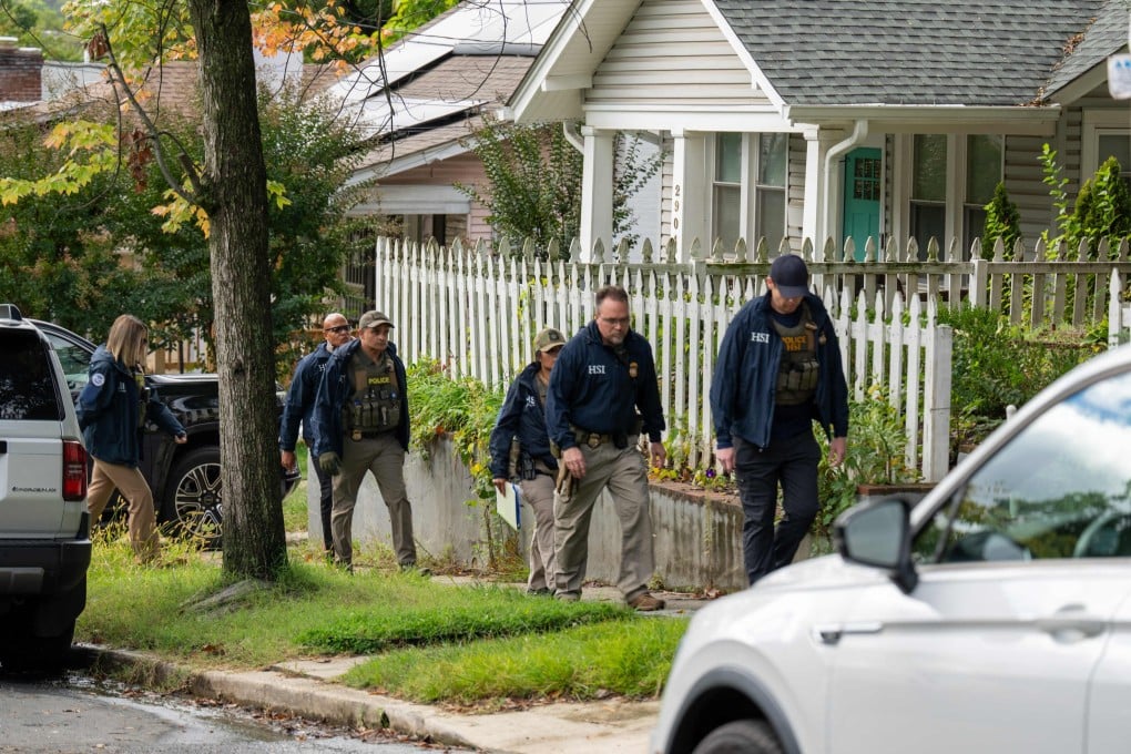 Homeland Security Investigations police search the Washington home of Minnesota congresswoman Ilhan Omar on Monday. Photo: Getty Images via AFP
