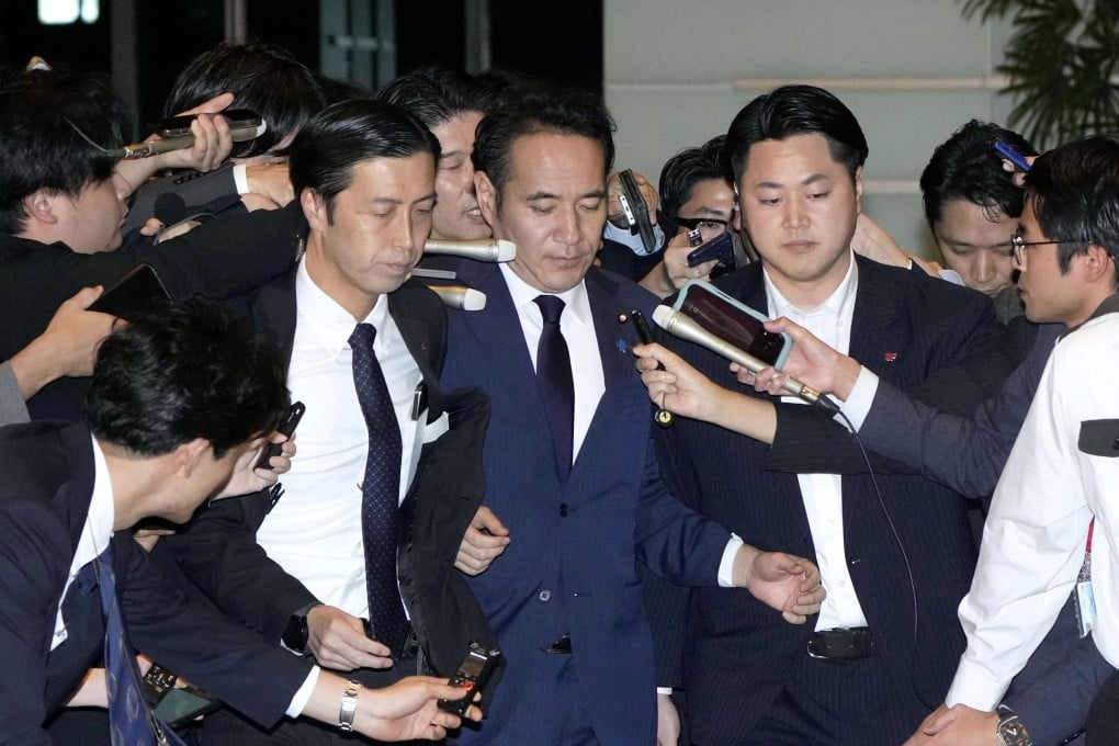 Agriculture Minister Kazuo Yana is surrounded by reporters as he arrives at the prime minister’s official residence to resign in Tokyo, on Wednesday. Photo: Kyodo via Reuters
