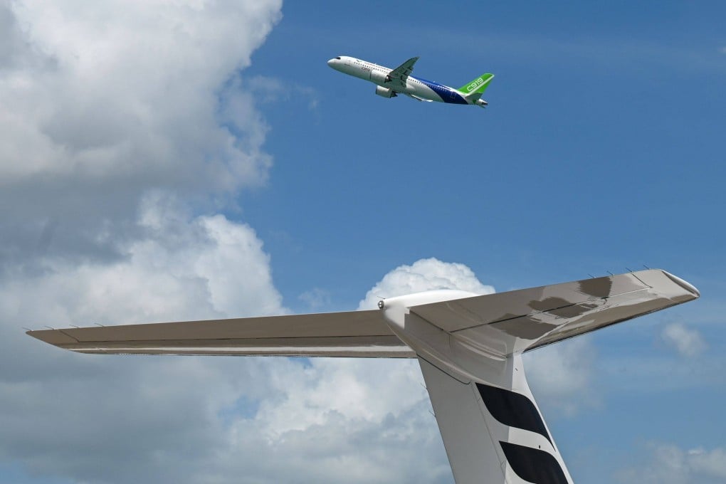 A C919 takes part in an aerial display at the Singapore Airshow in February. Photo: AFP