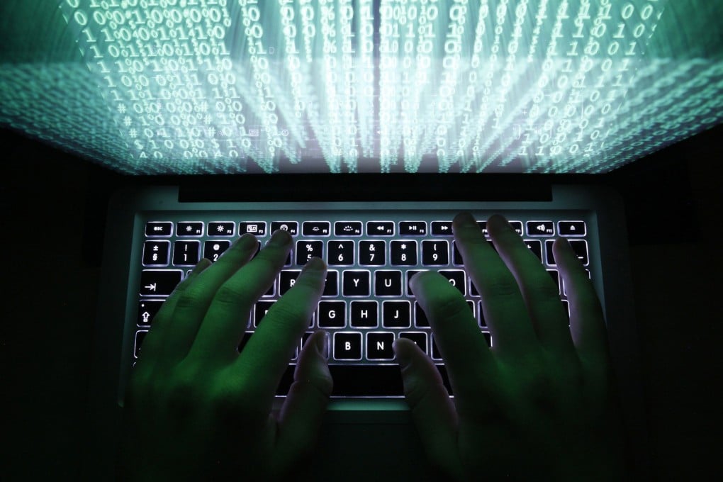 A man types on a computer keyboard. More than 500 breaches of Japanese corporate systems have been reported so far this year. Photo: Reuters