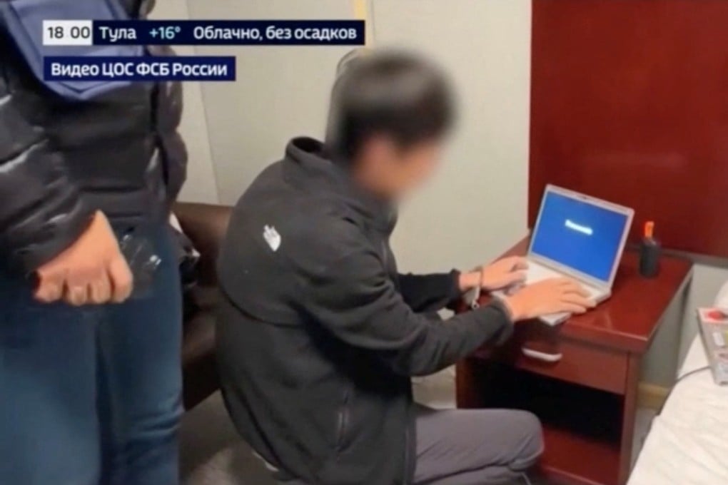 Russian state media footage released on Tuesday shows the arrest of a person, identified by Russia’s Federal Security Service as a Japanese journalist for the Hokkaido Shimbun newspaper. Photo” Rossiya-24 via Reuters