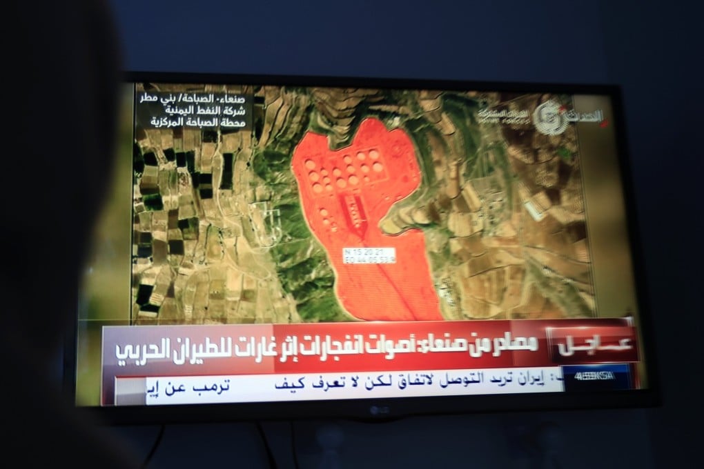 A television broadcast displaying an oil storage facility targeted by Saudi-led coalition strikes in Sanaa, Yemen. Photo: EPA