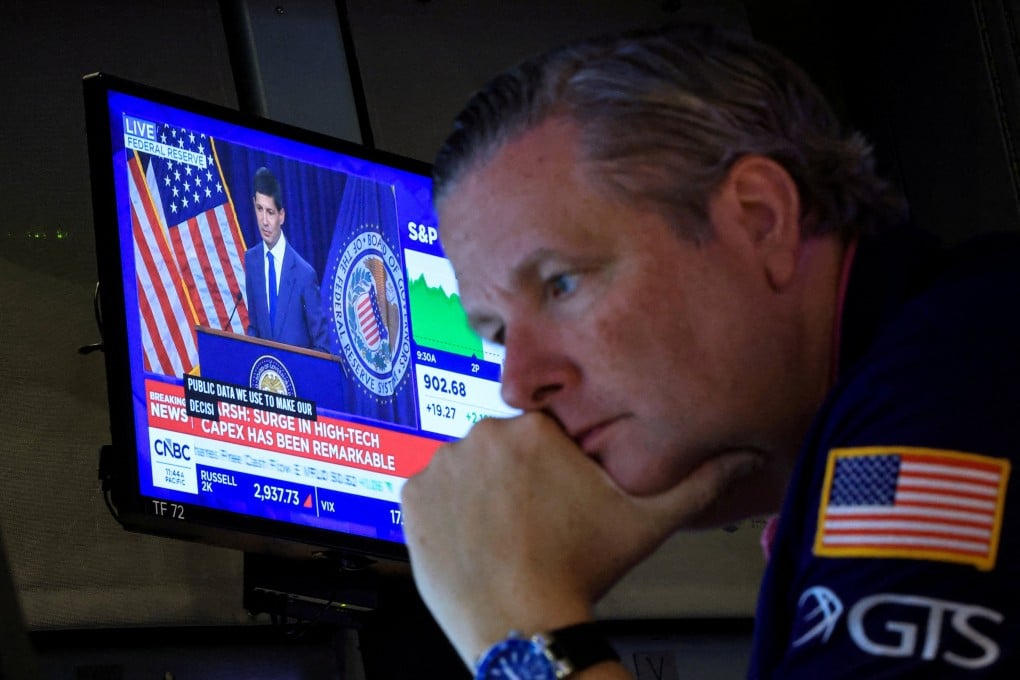 A trader works on the floor of the New York Stock Exchange in July. Photo: Reuters