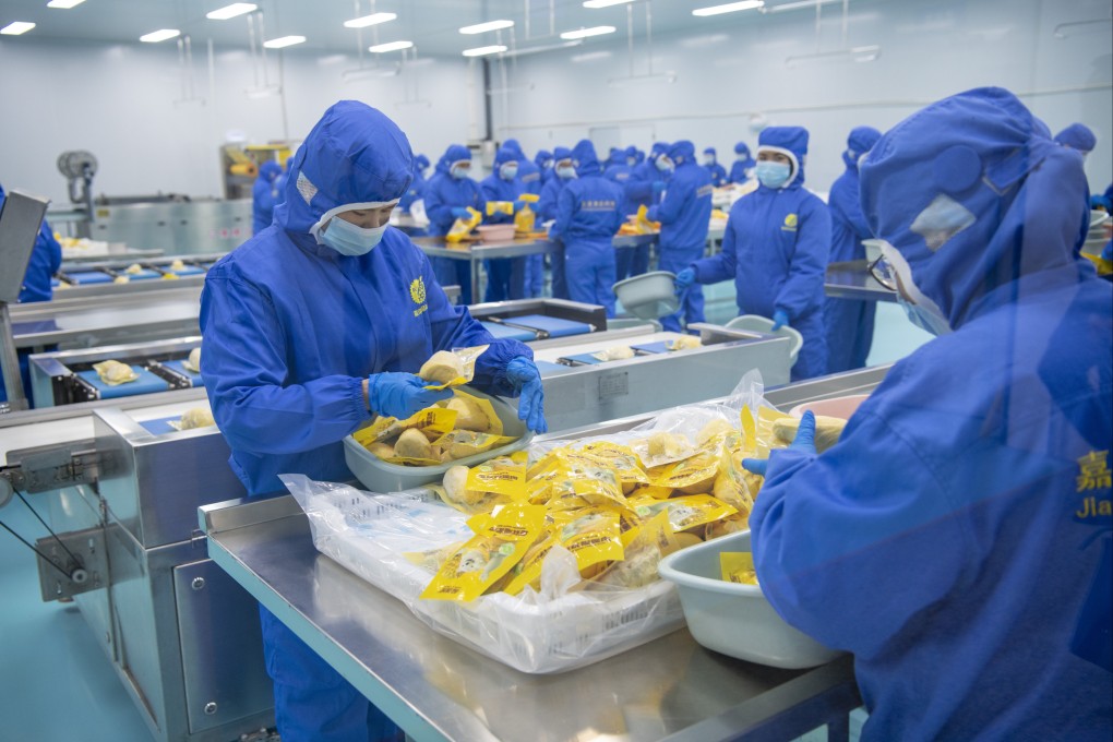 Workers process durian in Qinzhou, Guangxi Zhuang autonomous region, in January following the arrival of the first seaborne container of frozen Indonesian durian. Photo: Xinhua