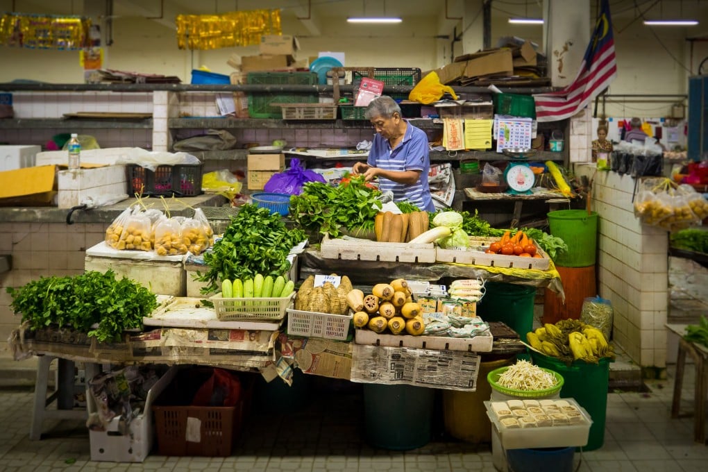 A vendor sells fruit and vegetables in Pasar Besar Bentong, a small town in the west side of Pahang Darul Makmur, Malaysia. Photo: Shutterstock