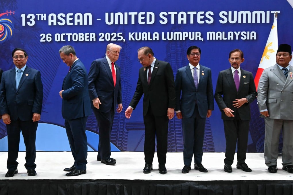 US President Donald Trump (third from left) gathers with Asean leaders during the summit in Kuala Lumpur on October 26, 2025. Photo: AFP