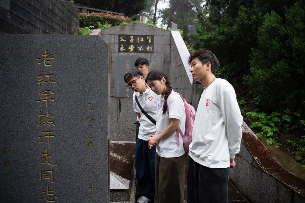Chinese students learn about the life stories of Red Army soldiers who took part in the Long March at a revolutionary martyrs’ cemetery in Jinzhai county, Anhui province, on September 28. Photo: Xinhua