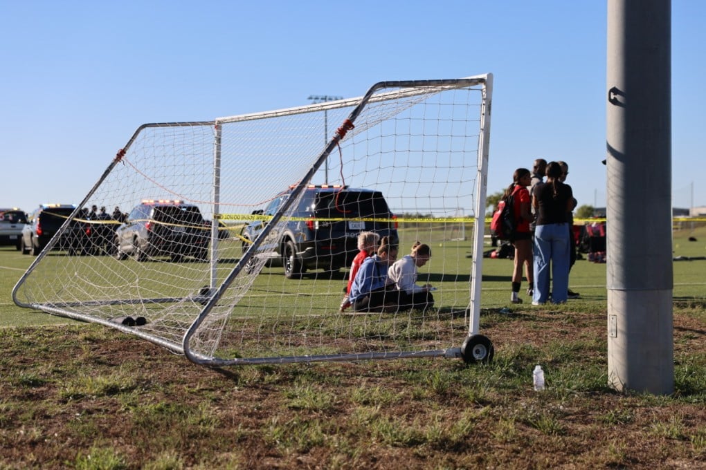 Police on the scene where a woman drove a car through a football field during a match in Wichita, Kansas on Saturday. Photo: KAKE via AP