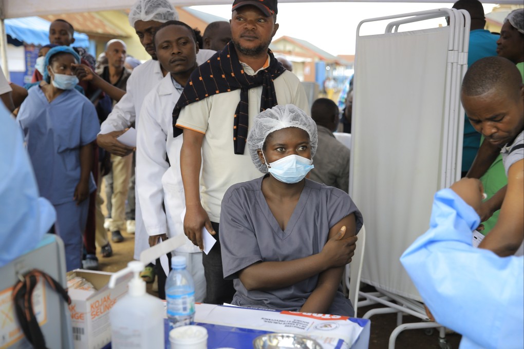 Healthcare workers queue to receive a dose of Ervebo vaccine against the Ebola virus in Beni, North Kivu province, eastern DR Congo on Friday. Photo: AP