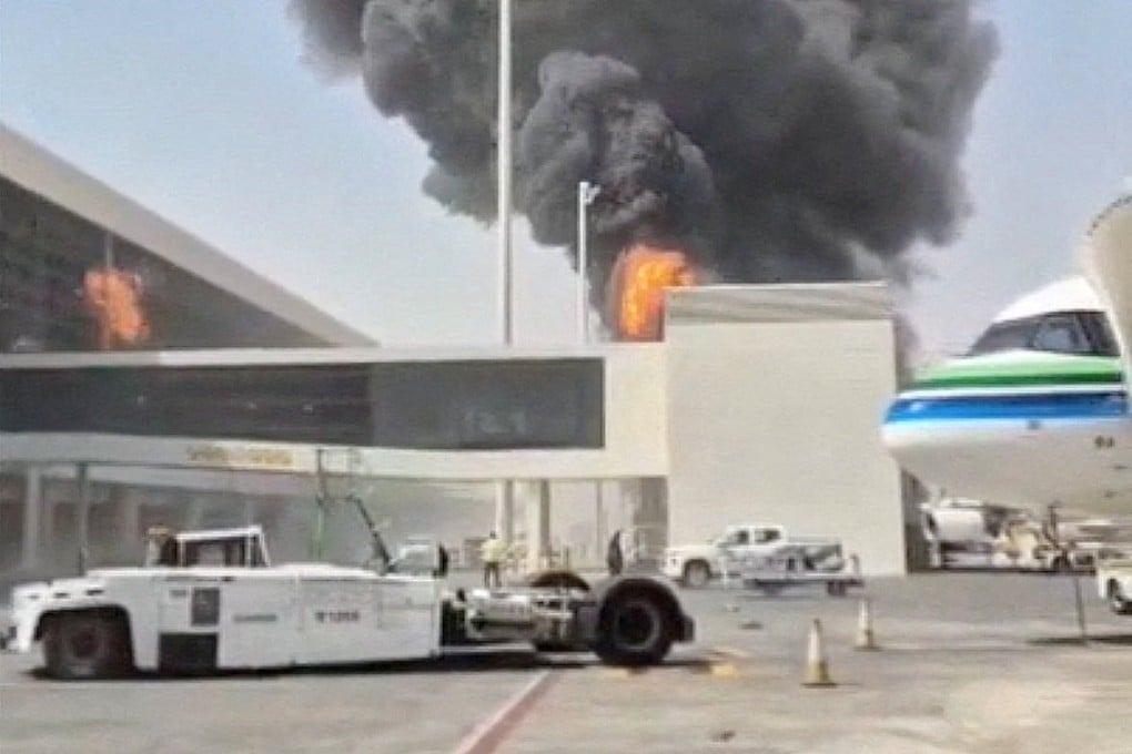 Smoke and flames rise from King Khalid Airport in Riyadh, Saudi Arabia, on October 8 after an attack by Houthis. Photo: Screengrab via social media/Reuters