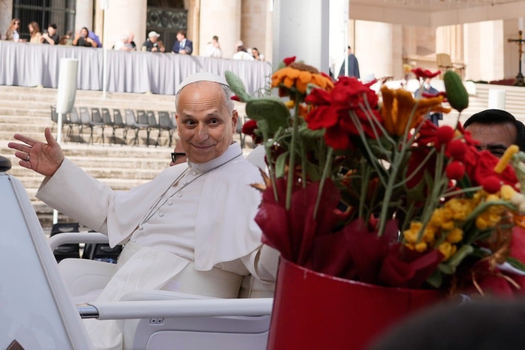 Pope Leo is presented with flowers as he leaves at the end of the general audience in St Peter’s Square at The Vatican on Wednesday. Photo: AP