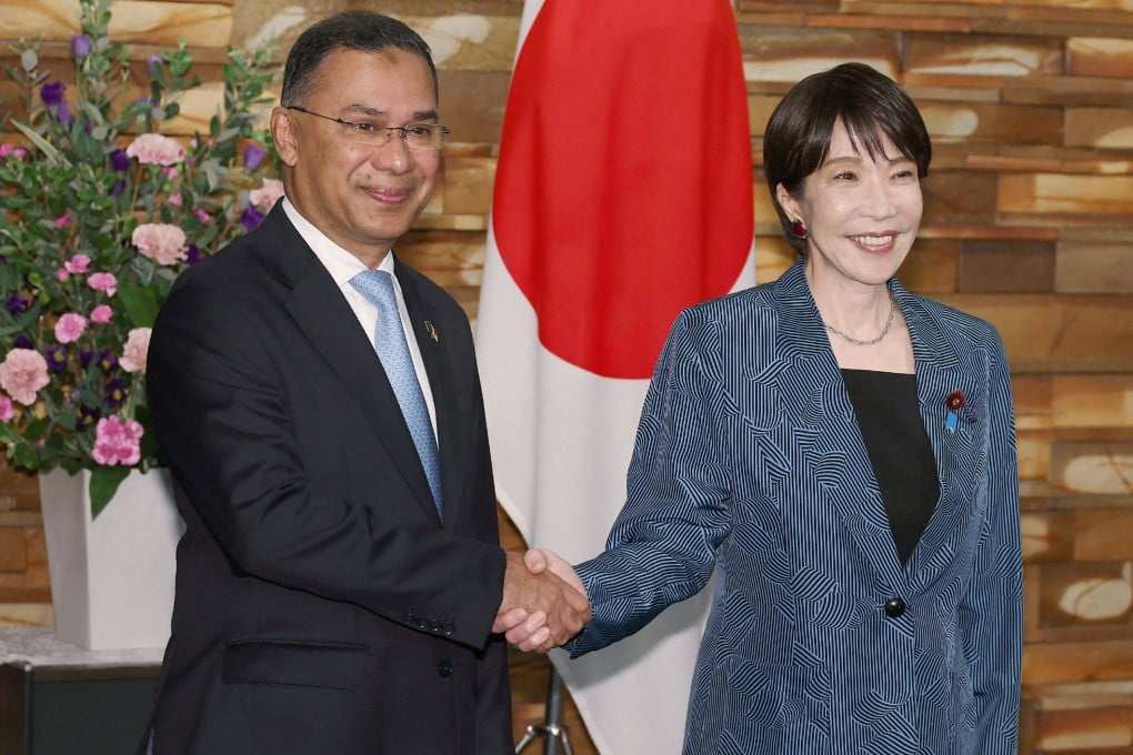 Japanese Prime Minister Sanae Takaichi (right) and Bangladeshi Prime Minister Tarique Rahman shake hands ahead of their meeting at the Prime Minister’s Office in Tokyo on October 27. Photo: AFP
