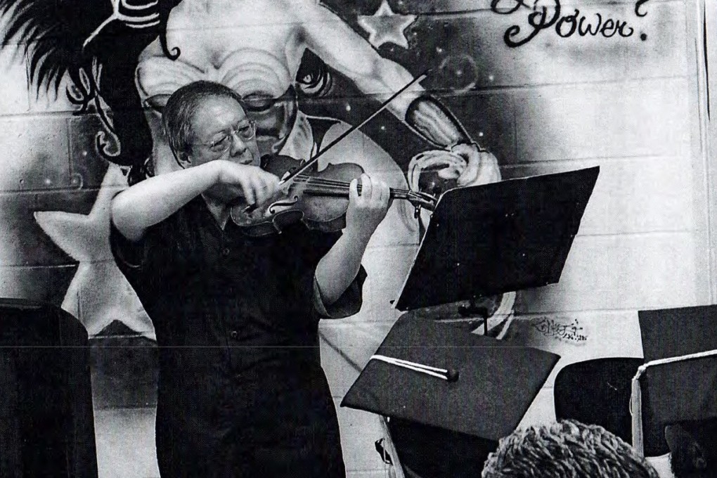 Patrick Ho plays the violin in a Christmas Show at New York Metropolitan Correctional Centre in December. Photo: New York Southern District Court documents.