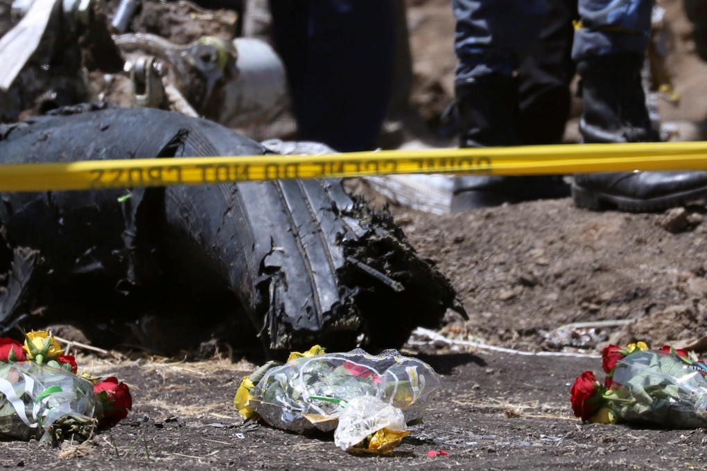 Flowers placed at the scene of the Ethiopian Airlines crash in Ethiopia. Photo: Reuters