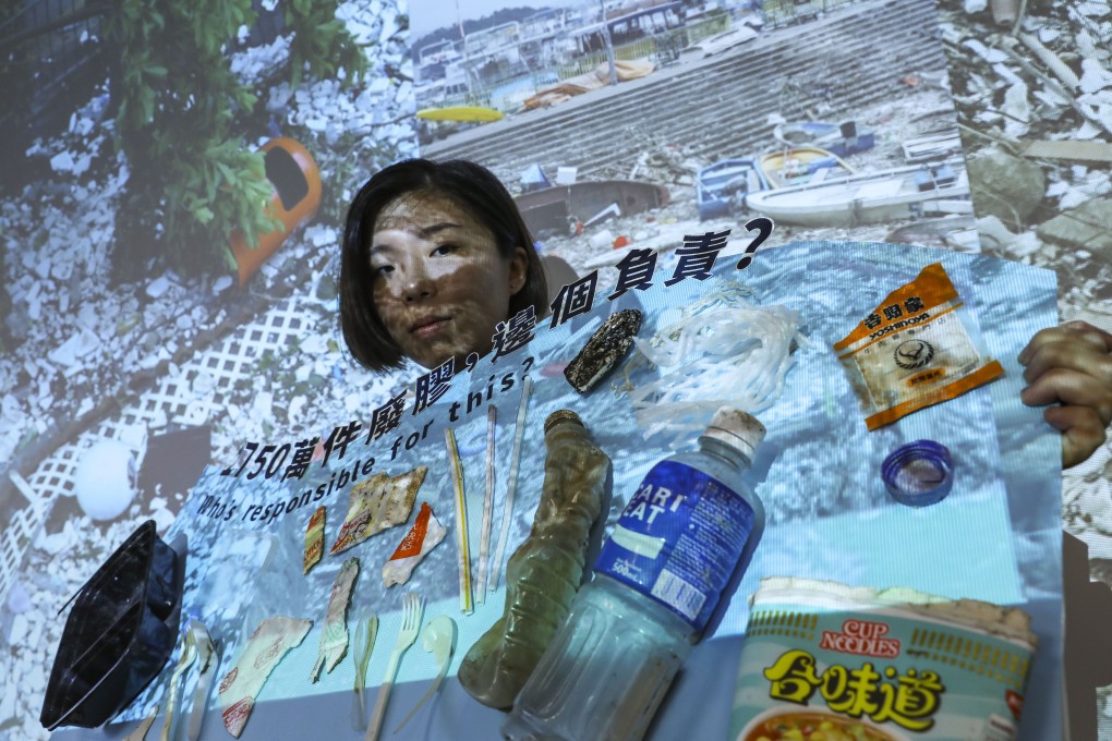 Greenpeace campaigner Chan Hall-sion with some of the single-use plastic found in Hong Kong’s waters. Photo: Sam Tsang