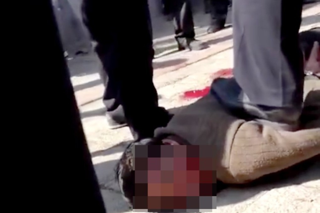 Video footage purports to show a suspect apprehended by police after reports of assaults on pupils at a primary school in Tangshan in Hebei province. Photo: Handout