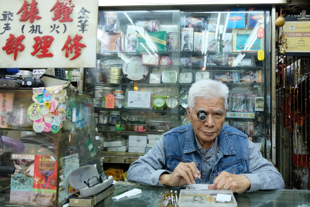 A watch repair craftsman works in his shop at Yue Man Square in the centre of Kwun Tong. The building is being redeveloped by the Urban Renewal Authority. Photo: Kelly Fung