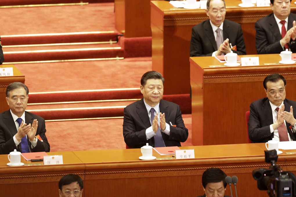 Wang Yang, chairman of the Chinese People's Political Consultative Conference (left), President Xi Jinping and Premier Li Keqiang during the closing of the Second Session of the 13th National People's Congress at the Great Hall of the People in Beijing. Photo: Bloomberg