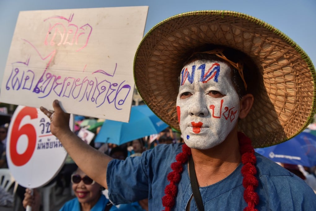 A Pheu Thai supporter in Bangkok. Photo: AFP