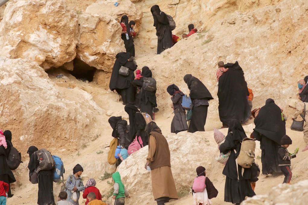 Surrendering families of Islamic State militants in the village of Baghouz, Deir Al Zor province, Syria, March 14, 2019. Photo: Reuters/Issam Abdallah