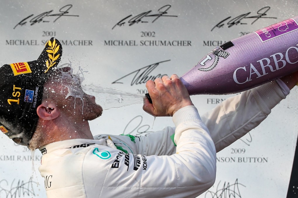 First-placed Mercedes driver Valtteri Bottas of Finland celebrates during the awarding ceremony of the Formula 1 Australian Grand Prix 2019 at the Albert Park in Melbourne. Photo: Xinhua