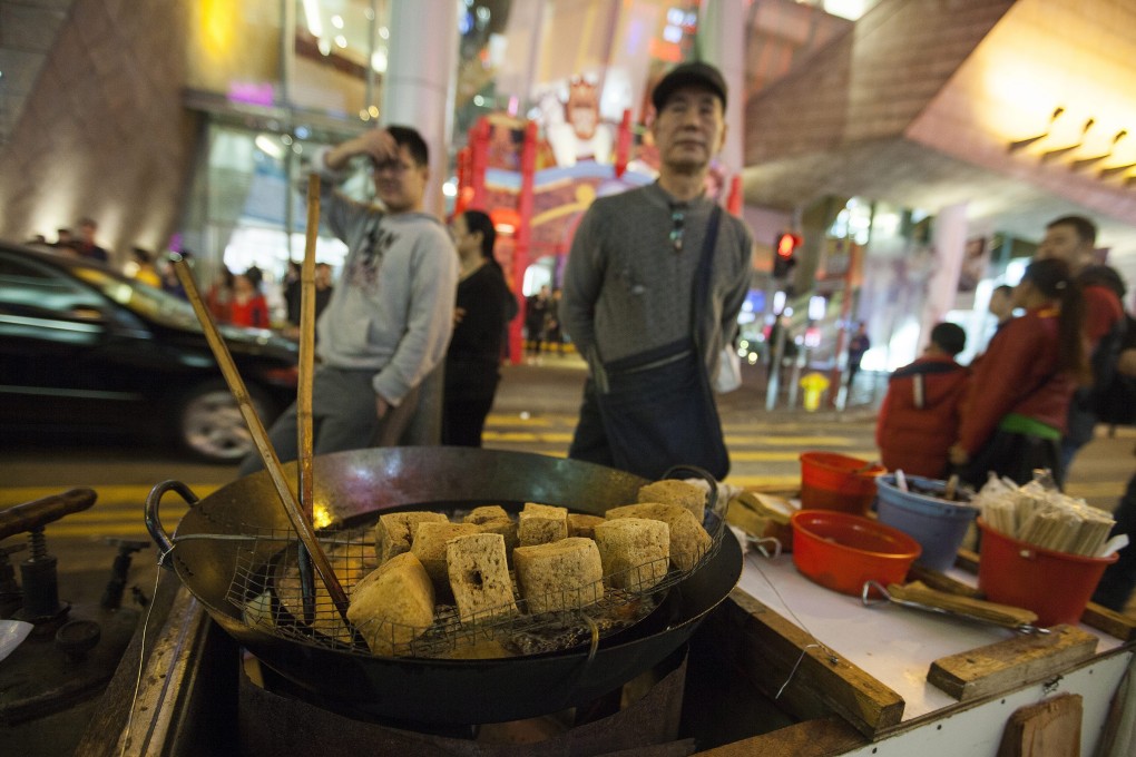 A stinky tofu stall on Portland Street, Mong Kok, during Lunar New Year 2016. Photo: EPA
