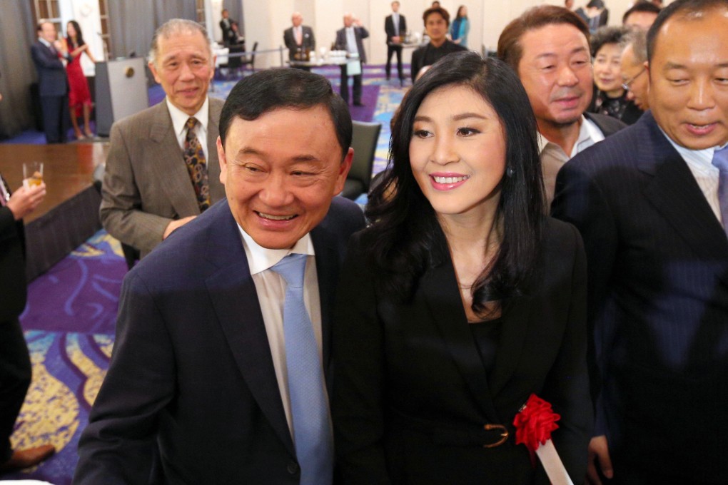 Thaksin and Yingluck Shinawatra at an event in Tokyo in March last year. Photo: AFP
