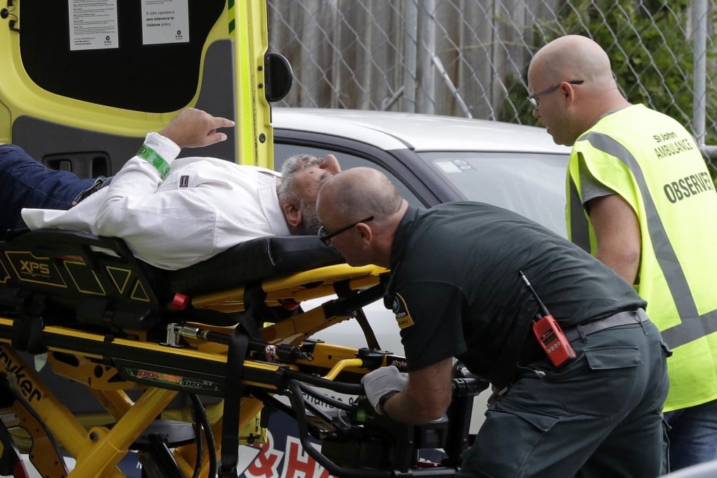 Ambulance staff attend to a victim. Photo: AP