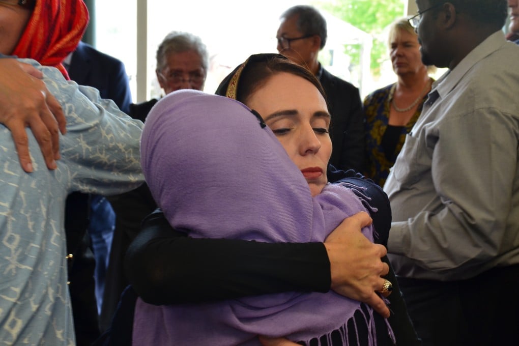 New Zealand Prime Minister Jacinda Ardern (C) with members of the Muslim community in Christchurch. Photo: EPA-EFE
