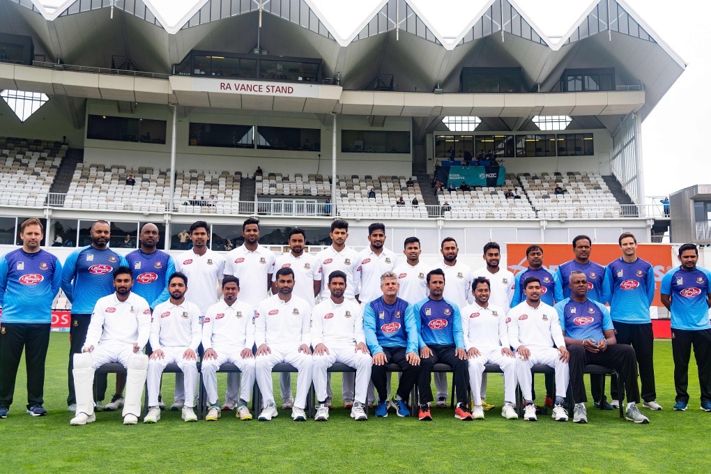 Bangladesh's team players and officials pose for a group photograph during day four of the second cricket Test match between New Zealand and Bangladesh at the Basin Reserve in Wellington on March 11, 2019. Photo: AFP
