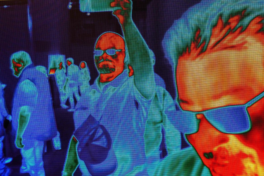 People are captured by FLIR (Forward-Looking Infrared) HD Thermal Imaging Cameras as they walk near the FLIR exhibit at the Las Vegas Convention Center during CES 2019 in Las Vegas on January 10, 2019. Photo: AFP