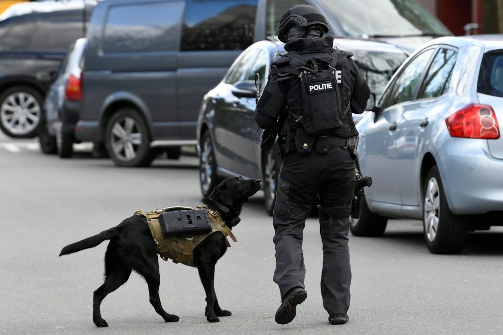 A police officer with a service dog on patrol after the shooting in Utrecht on March 18, 2019. Photo: Reuters