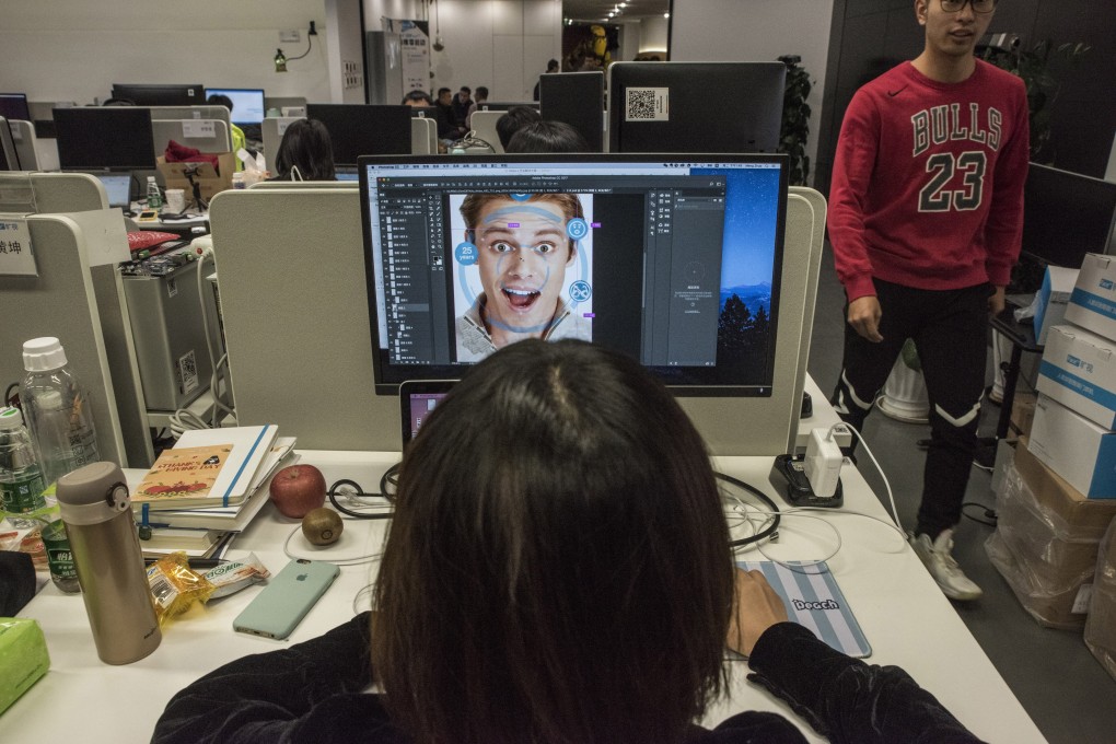 At Megvii offices in Beijing, a designer prepares marketing material for a facial-recognition product. The company's marketing manager has said Megvii's Face program has helped police make thousands of arrests. Photo: The Washington Post
