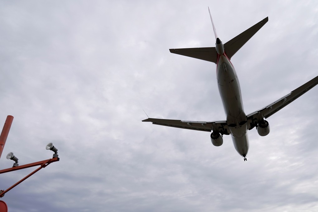 An American Airlines Boeing 737 MAX 8 lands at Reagan National Airport shortly after an announcement was made by the FAA that the planes were being grounded by the United States on March 13, 2019. Photo: Reuters/Joshua Roberts