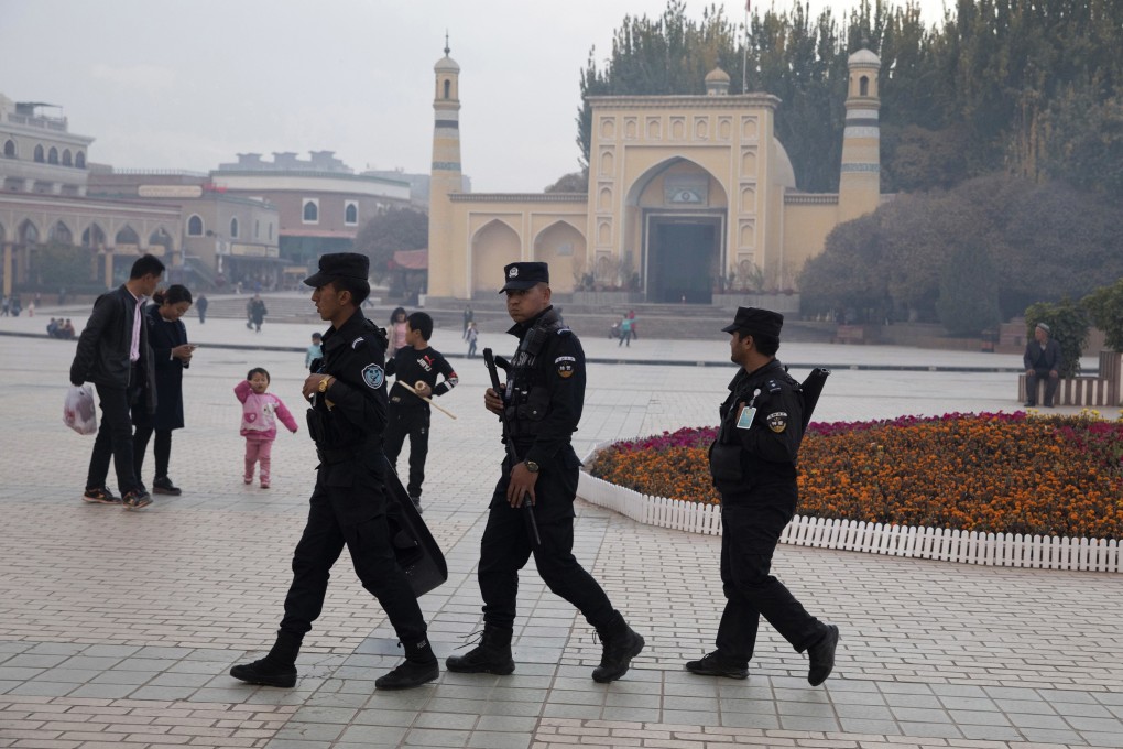 Security personnel patrol near the Id Kah Mosque in Kashgar in Xinjiang. Photo: AP