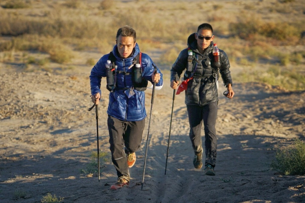 Liang Jing and Zhou Jiaju battle it out at the Ultra Gobi 400km. Lloyd Belcher works hard to capture the moments runners push through their lowest ebb. Photo: Lloyd Belcher Visuals