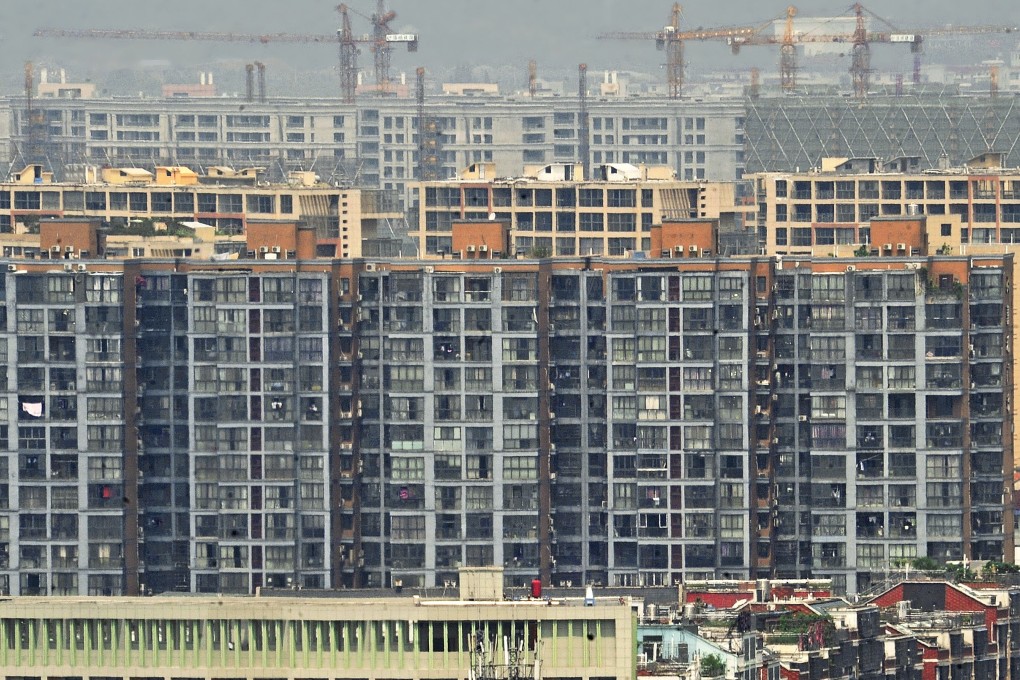 Many Chinese developers have been struggling amid elevated borrowing costs and strict property curbs in bigger cities. Photo: Xinhua