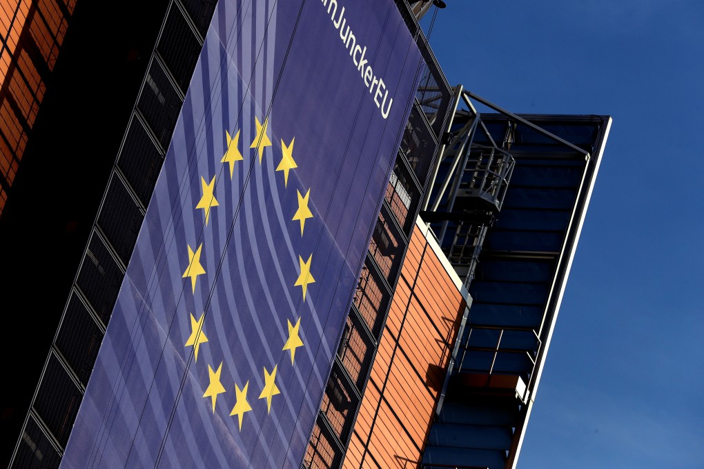 An EU flag outside the European Commission headquarters in Brussels, Belgium. Photo: Reuters