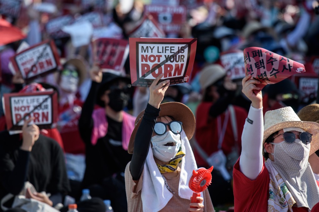 Protesters shout slogans during a rally in Seoul against spycam porn. Photo: AFP