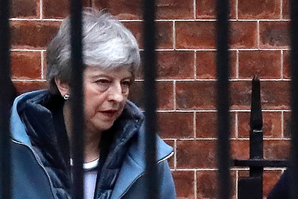 Britain’s Prime Minister Theresa May leaves from the rear of 10 Downing Street in London. Photo: AFP