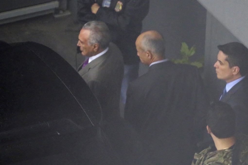 Former Brazil president Michel Temer (left) at the airport in Sao Paulo, Brazil on March 21, 2019. Photo: AP