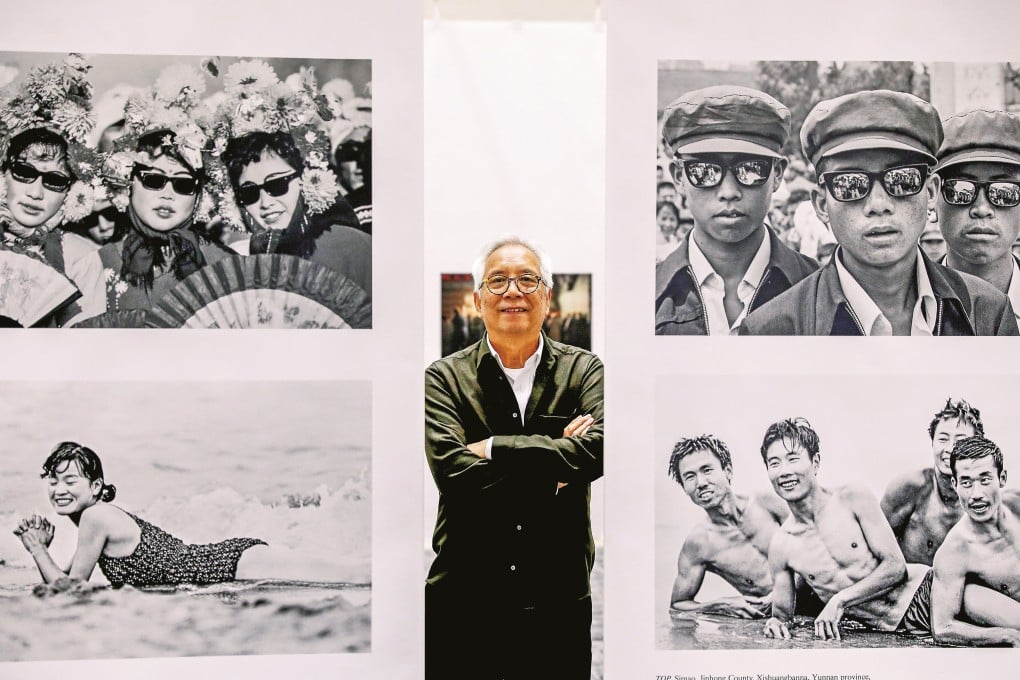Pulitzer Prize-winning photojournalist Liu Heung Shing with images from his solo exhibition A Life in a Sea of Red at the University of Hong Kong, Pok Fu Lam. Photo: Nora Tam